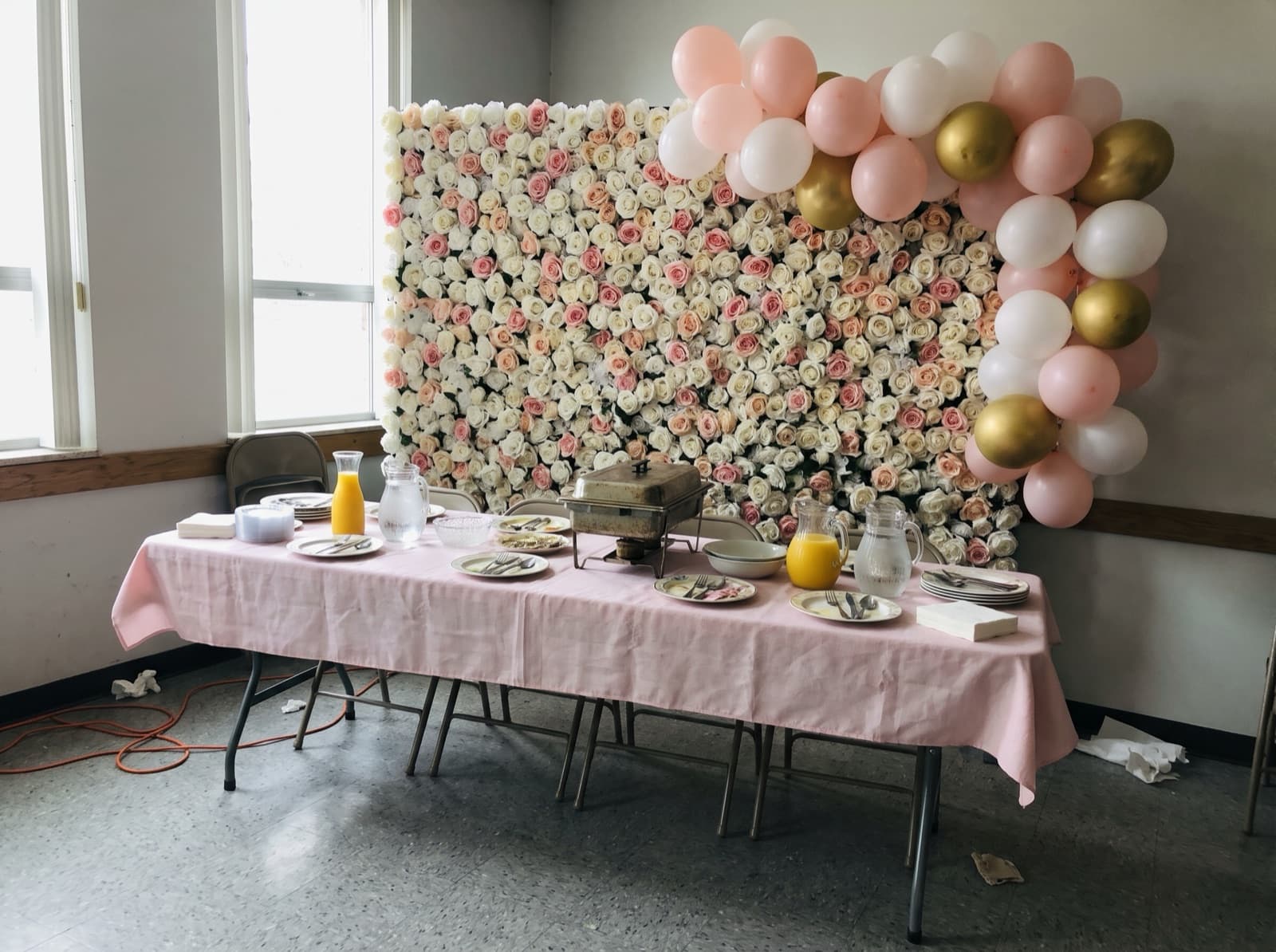 Flower wall backdrop with blush balloons