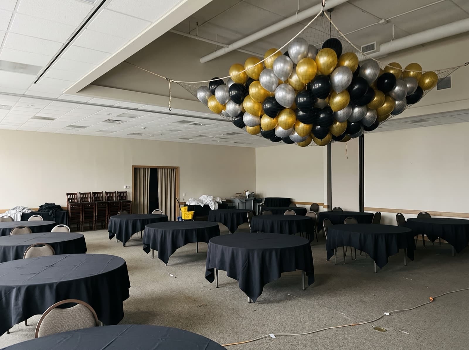 Balloon drop net overhead before a countdown