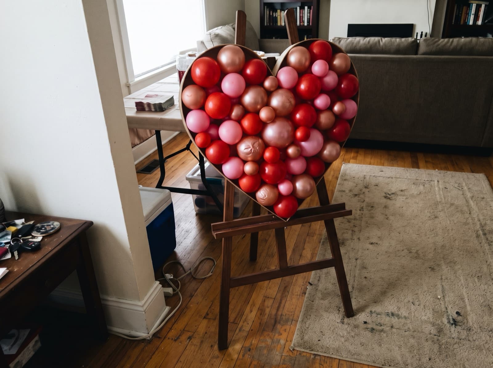 Heart-shaped balloon mosaic in red and pink