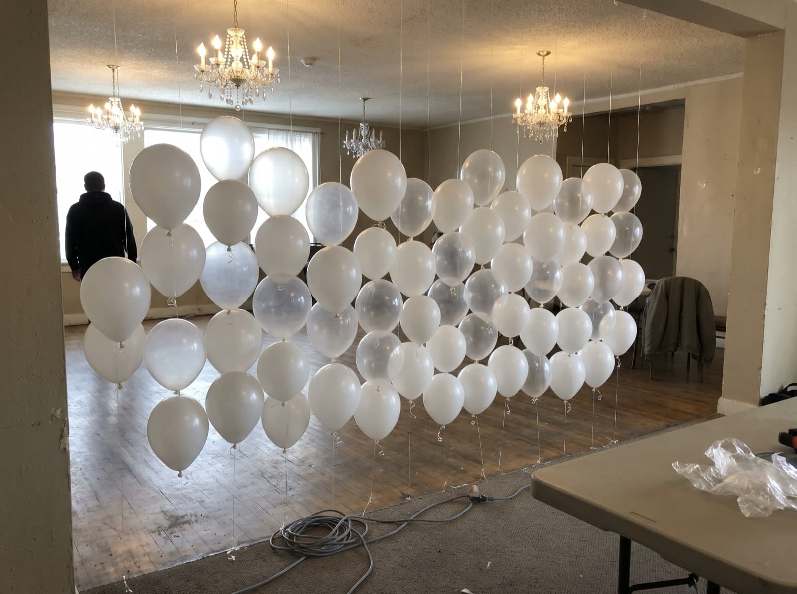 Floating helium balloon wall of white and clear balloons