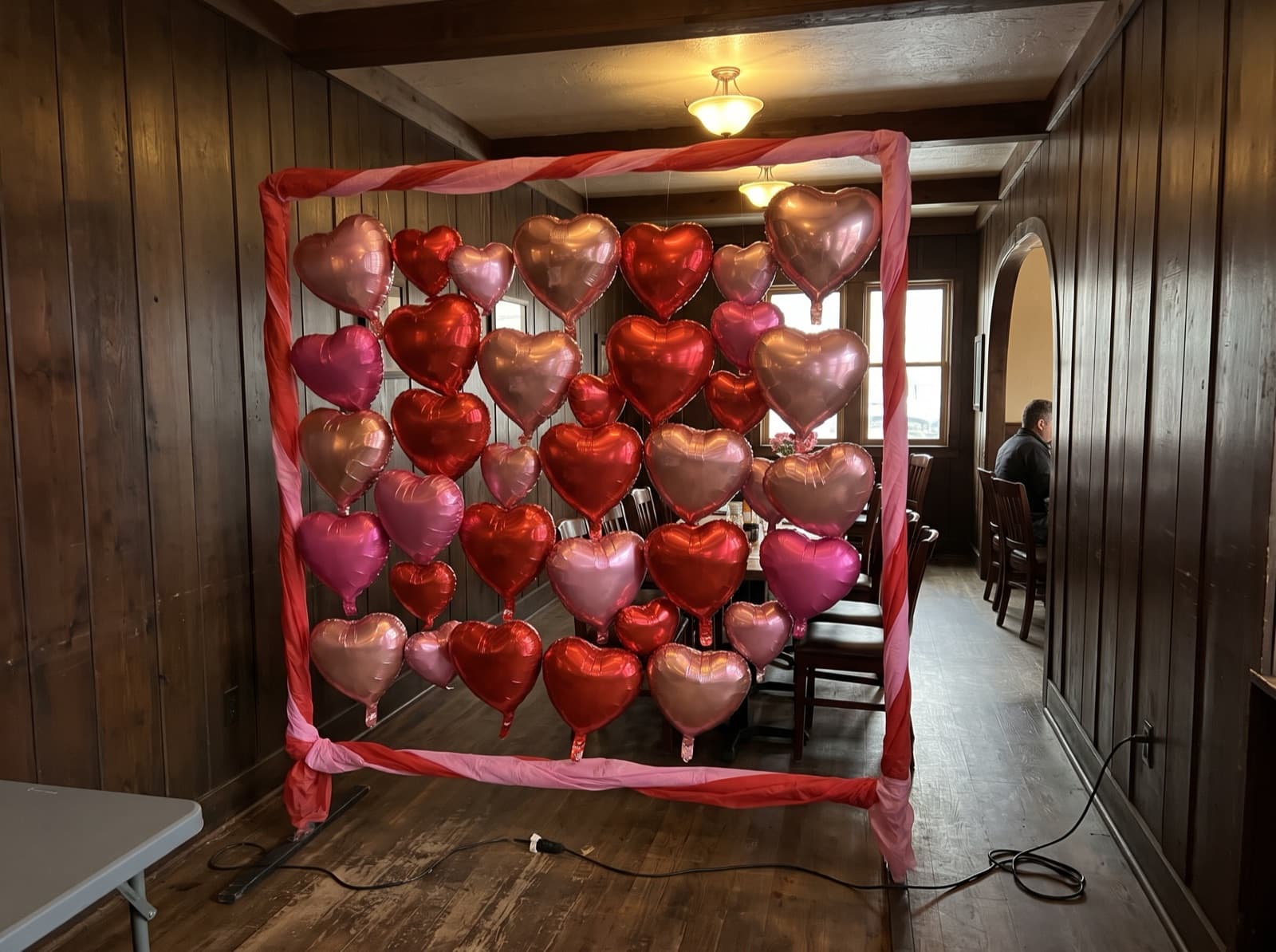 Foil heart balloon wall in red, pink and rose gold