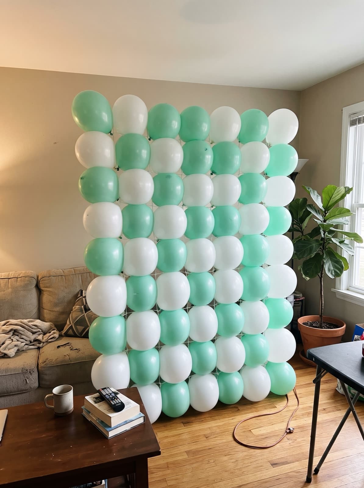 Grid balloon wall in a mint and white checkerboard